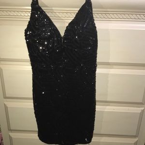 Tight black sequin mini dress